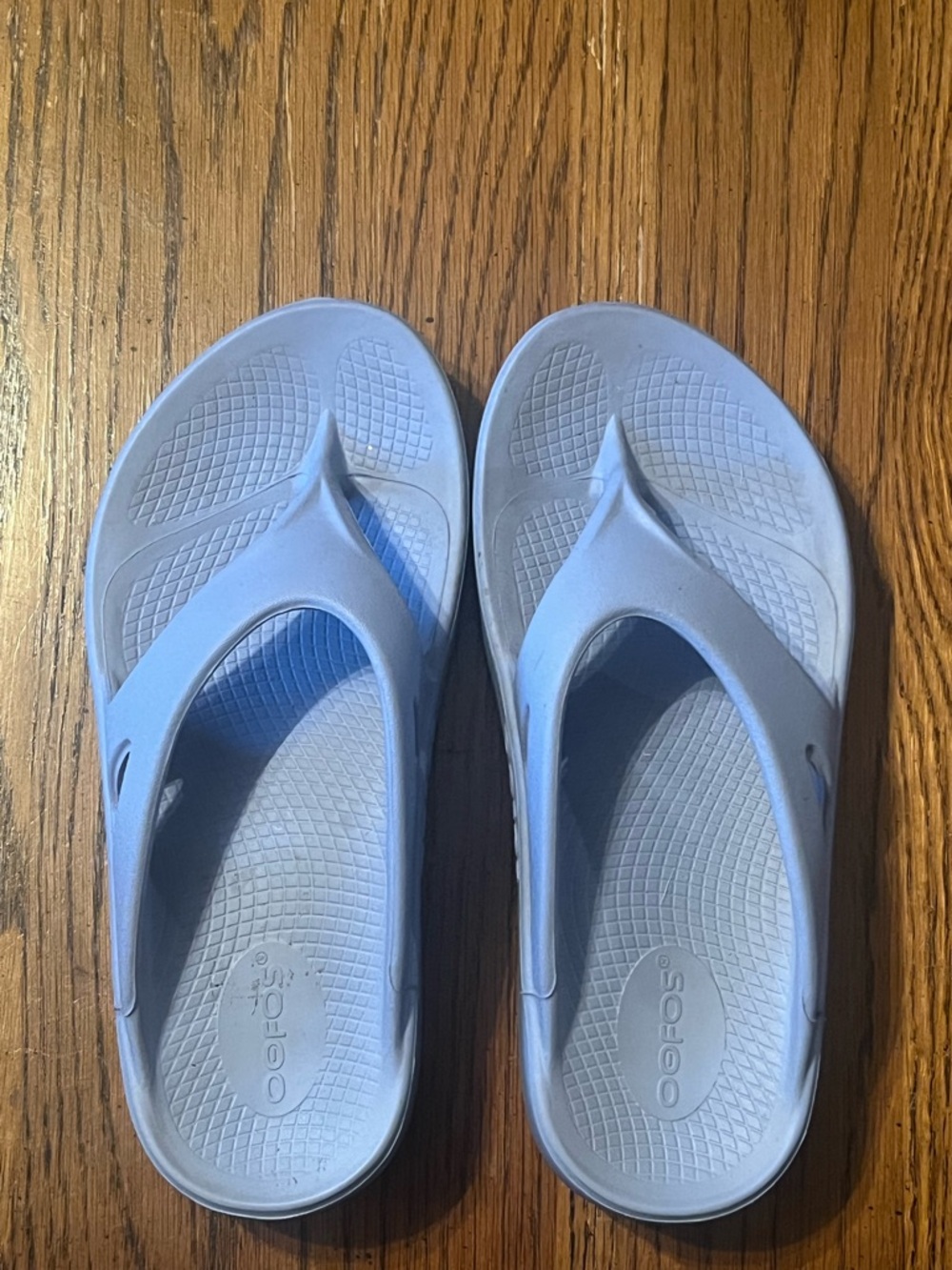 OOFOS light blue recovery flip flops